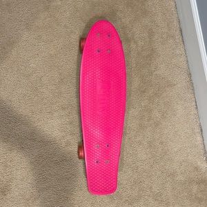 Penny Australia “nickel “ skateboard pink with neon pink lights at wheels.